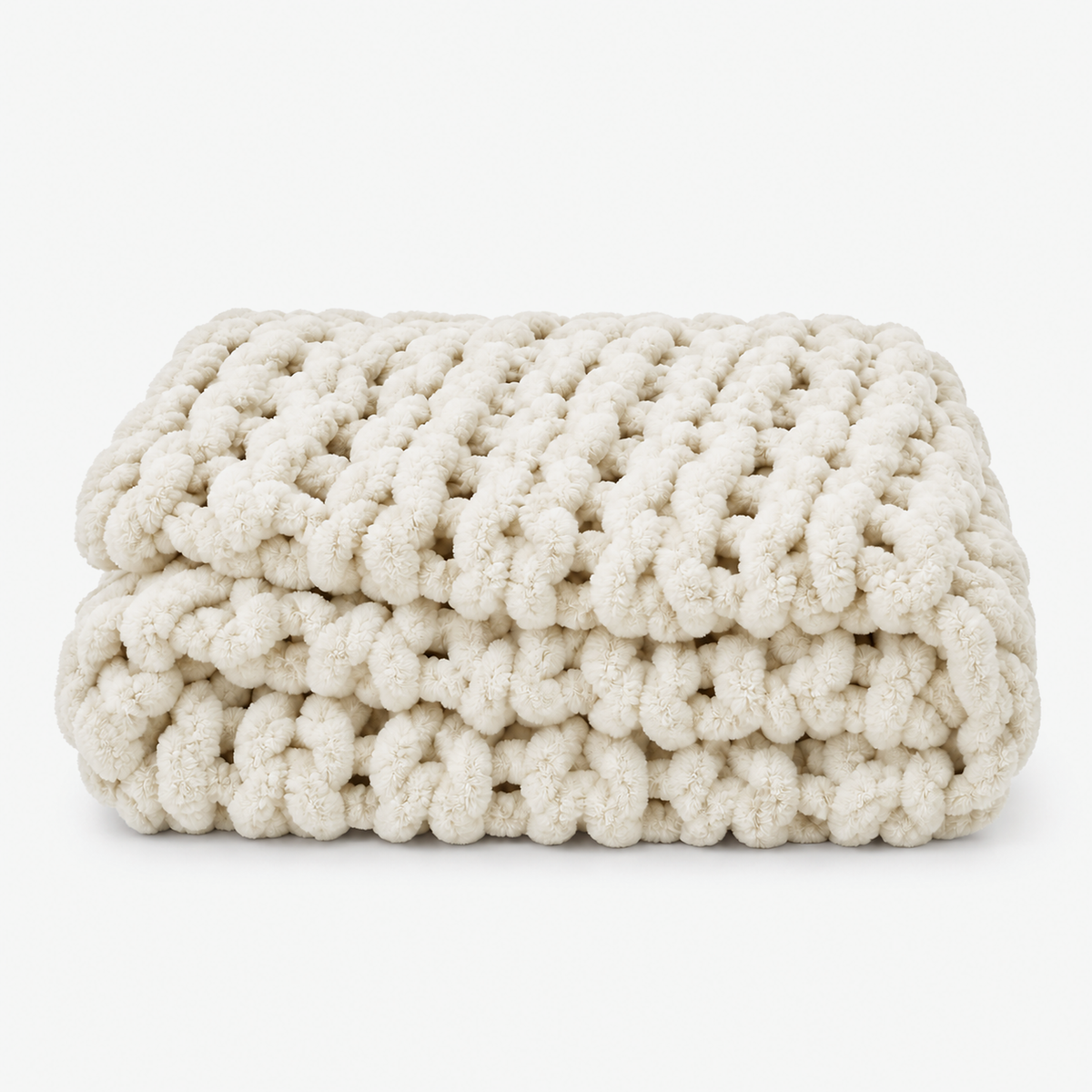Canimor white throw blanket in handmade chunky chenille, loosely folded into a stack #color_white