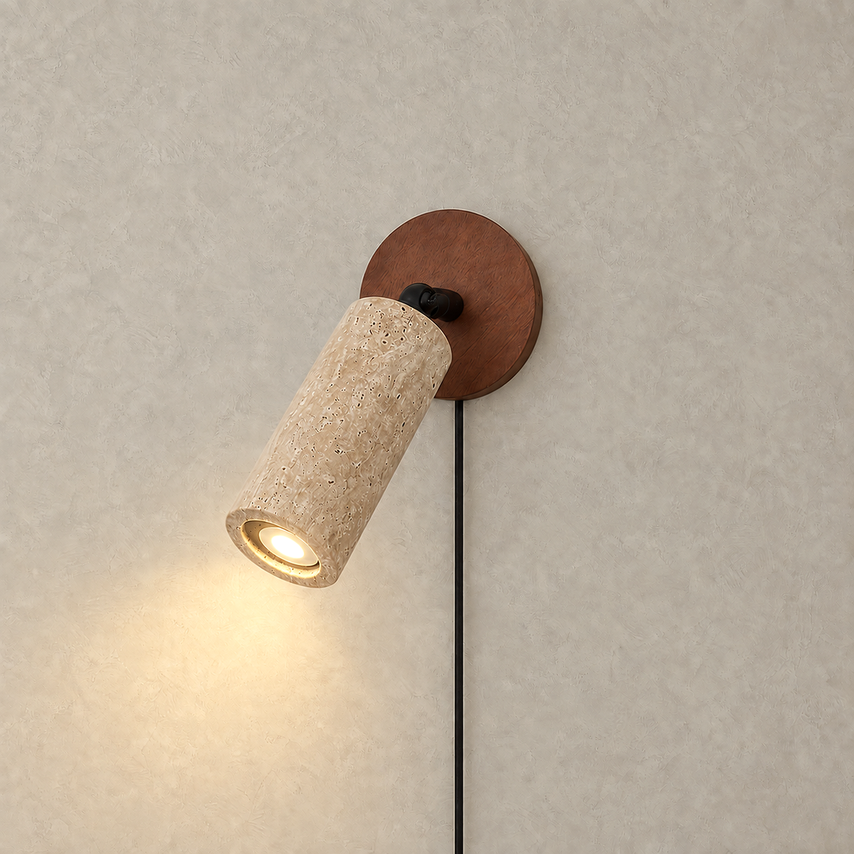 Cavenilo walnut color and yellow travertine LED wall sconce casting a warm downward pool of light