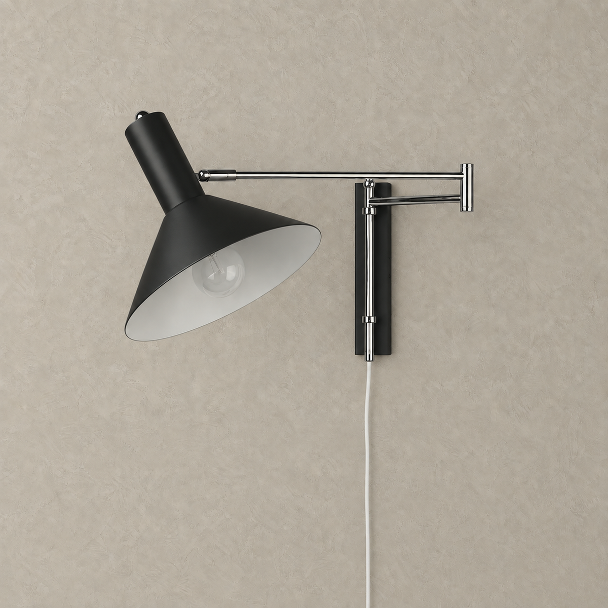 Celmoira black bedside wall light with matching backplate and silver arms on a plain background #color_black