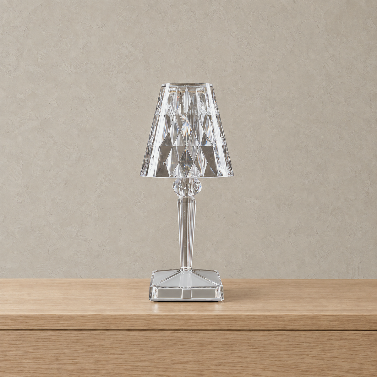 Cerilan clear table lamp unlit on a plain studio surface, shown from the front