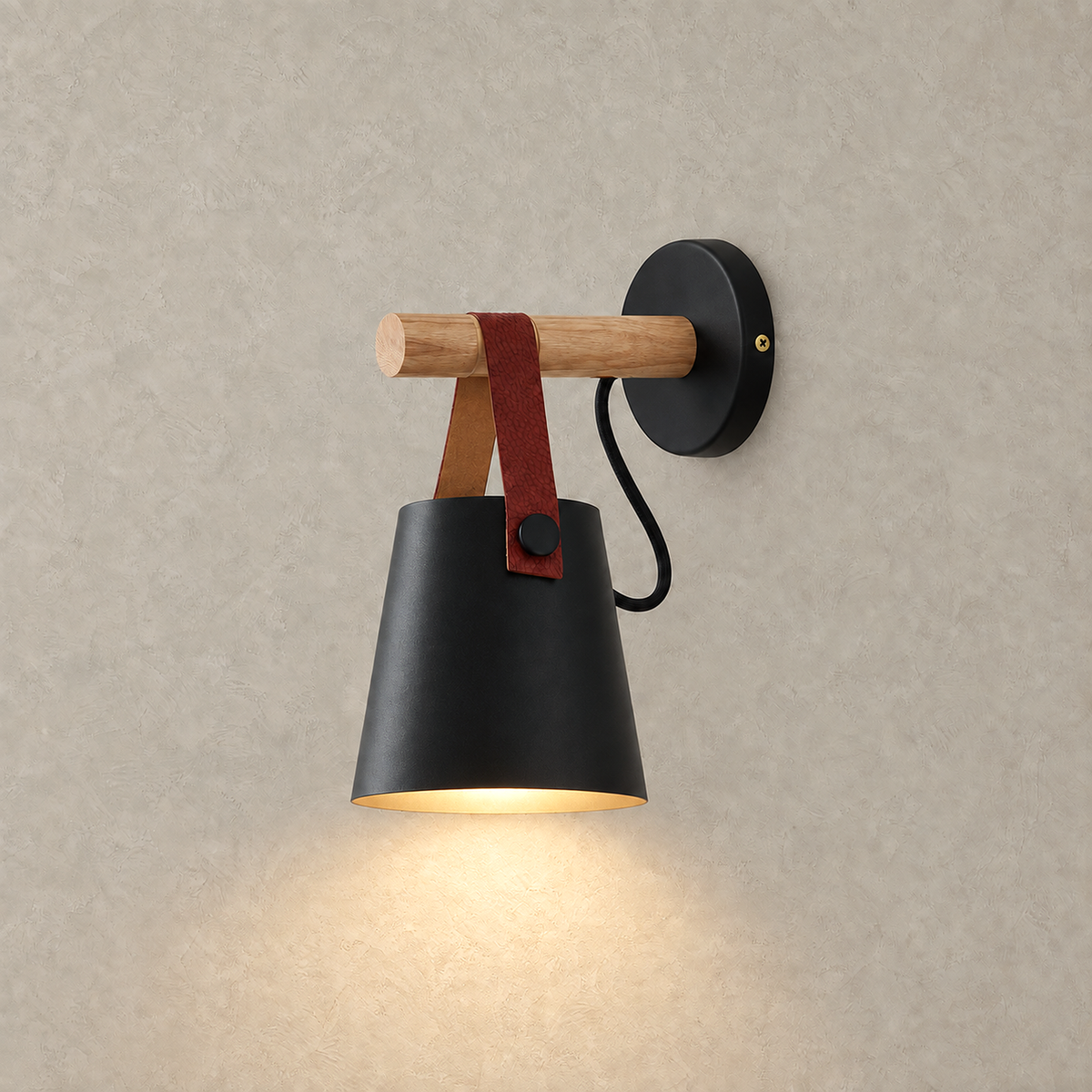 Cilarno black wall sconce lit against warm greige plaster on a studio plate