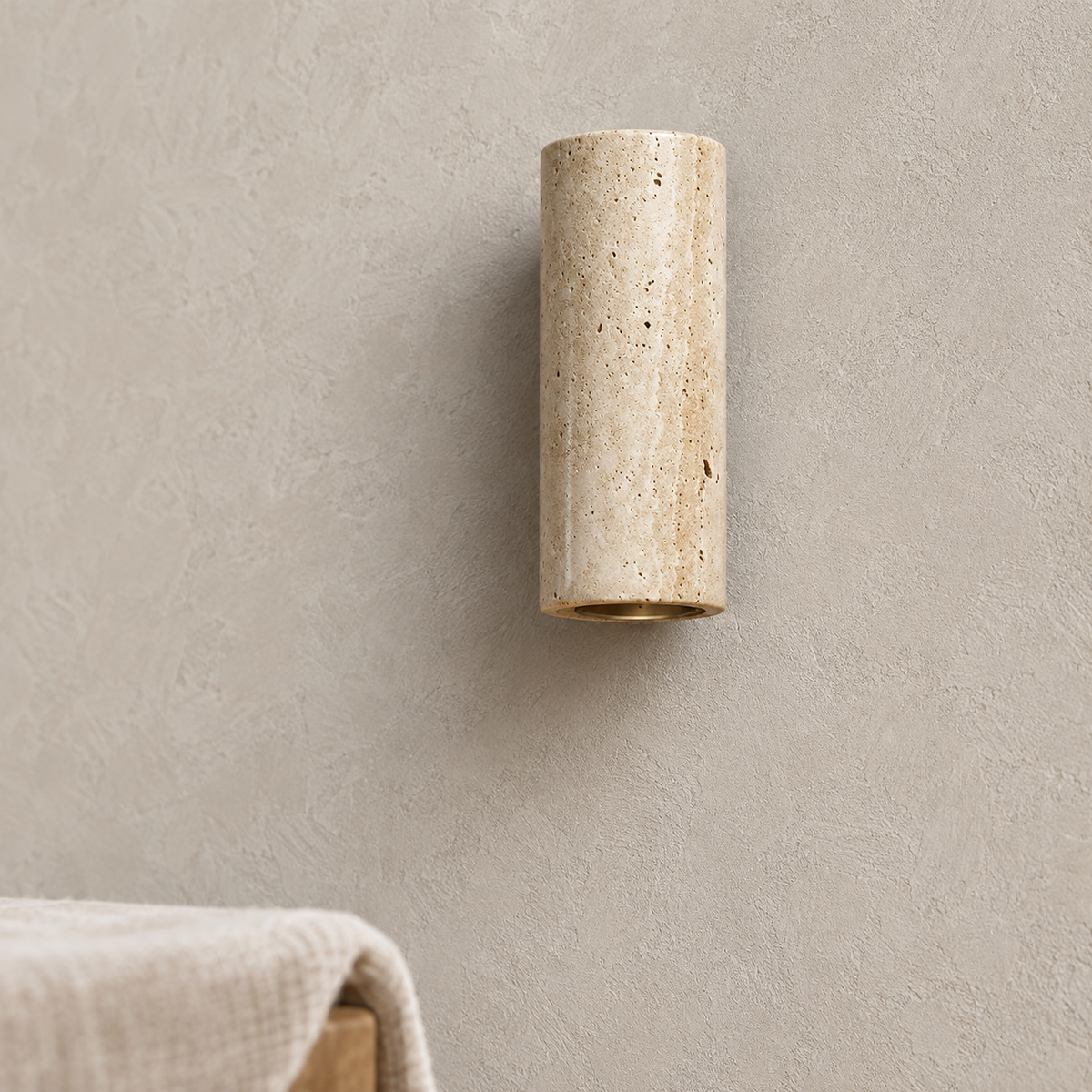 Cimorela travertine wall lamp close up, stone pores and the unlit lower rim opening