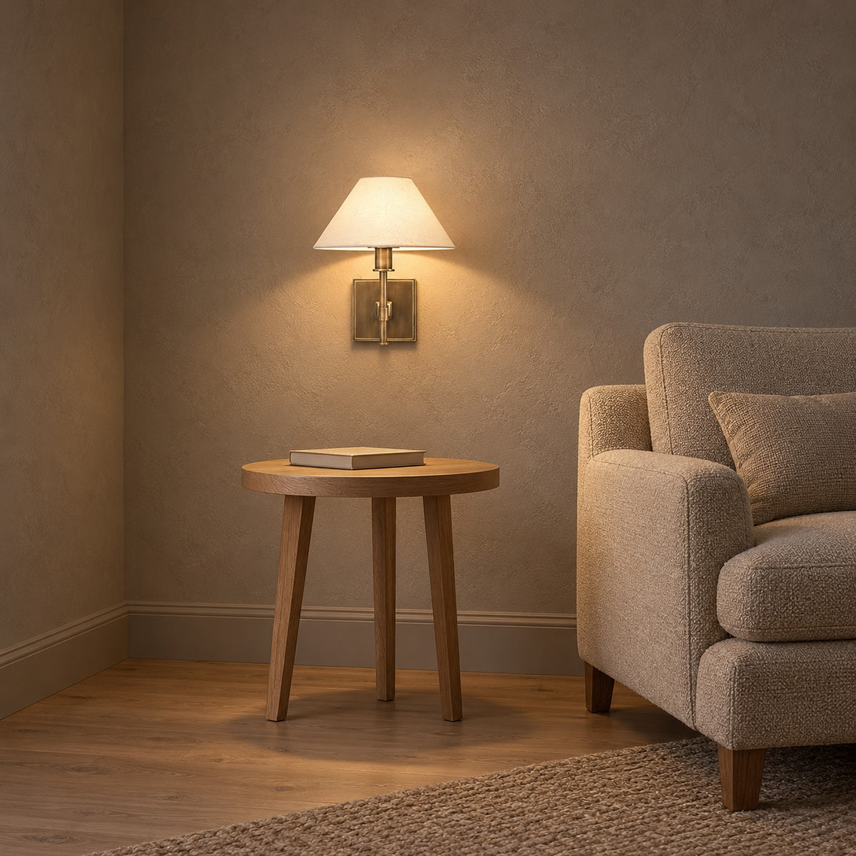 Ciralmo gold rechargeable wall sconce lit in a living room, keeping the chairside table clear