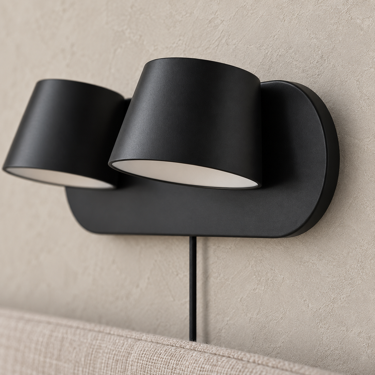 Cirelvo black bedside lamp head and unlit white shade edge in close guest bedroom detail