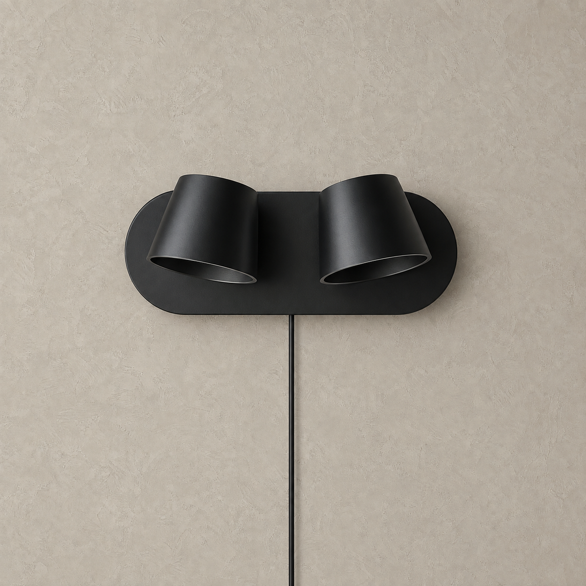Cirelvo black LED reading wall sconce with two heads switched off on a plain studio plate