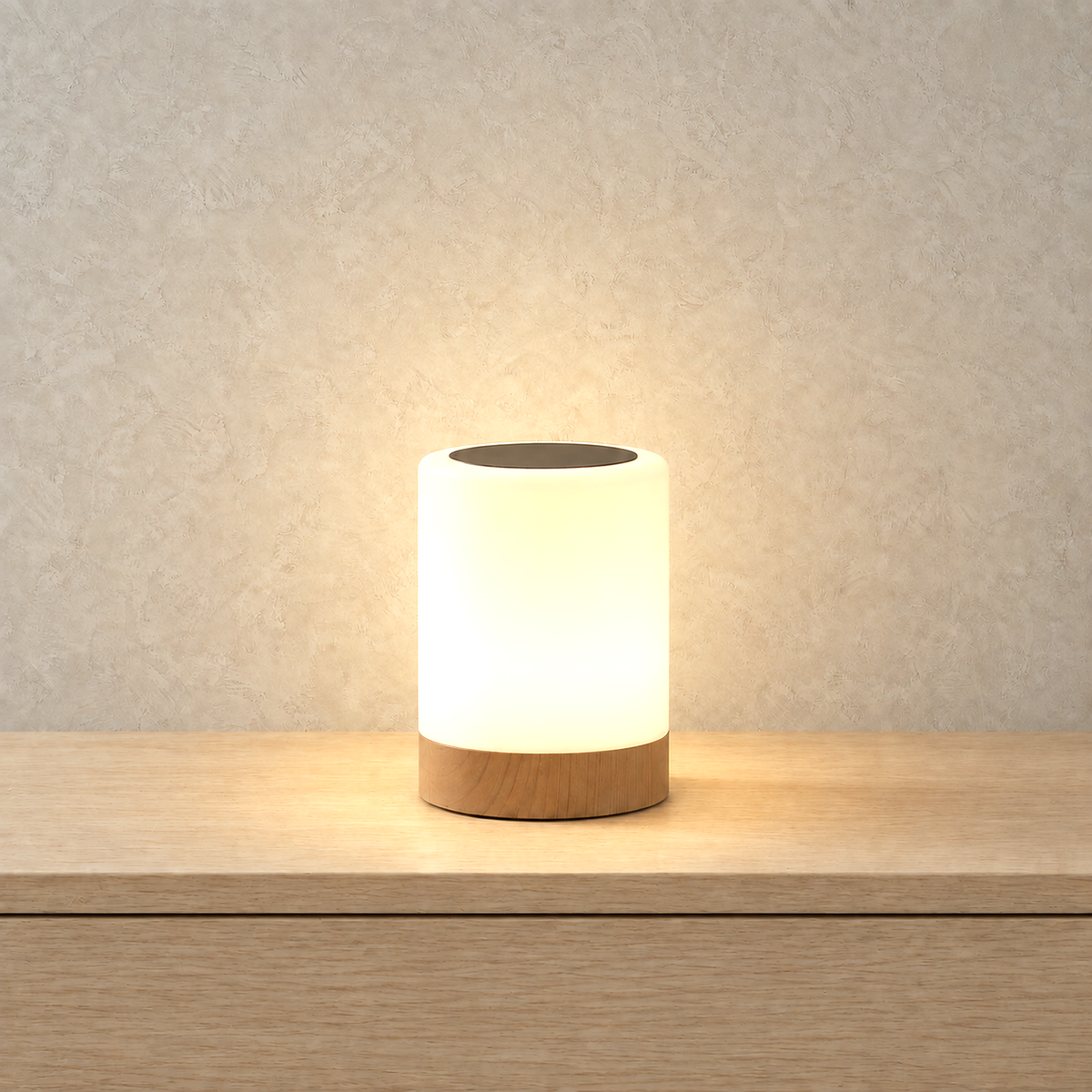 Cirmelva wood look table lamp switched on with its white body brightly illuminated