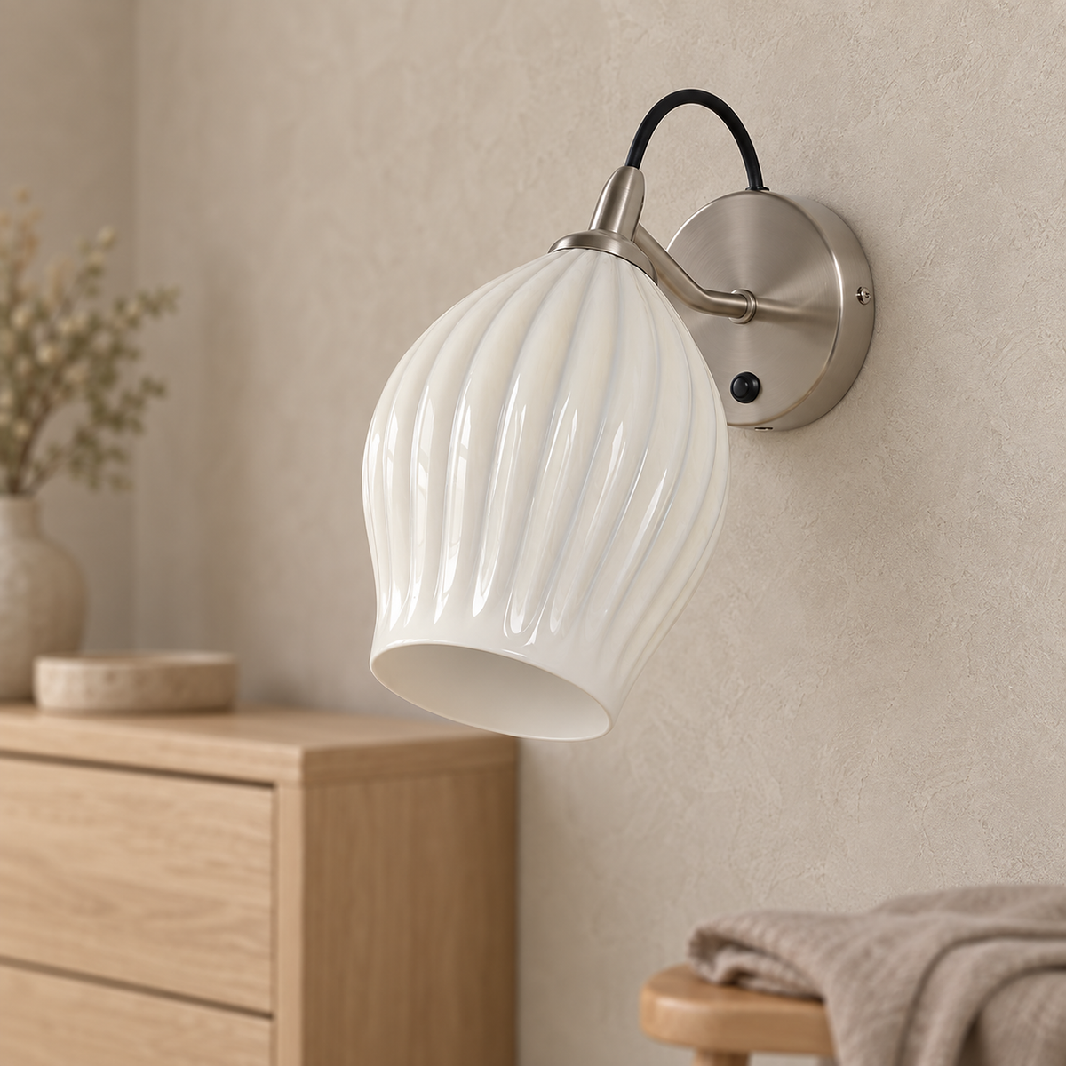 Comirel chrome wall lamp close up on the white ribbed shade of the wall mounted LED fixture