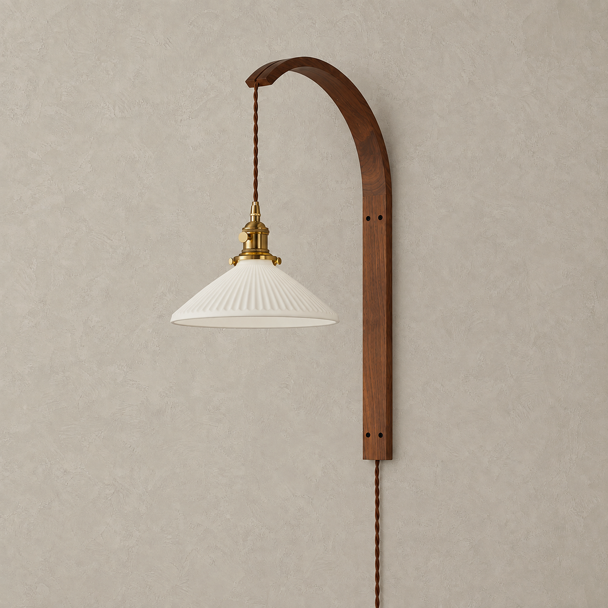Cosineri walnut color plug in wall sconce with a white flared shade unlit on a plain backdrop