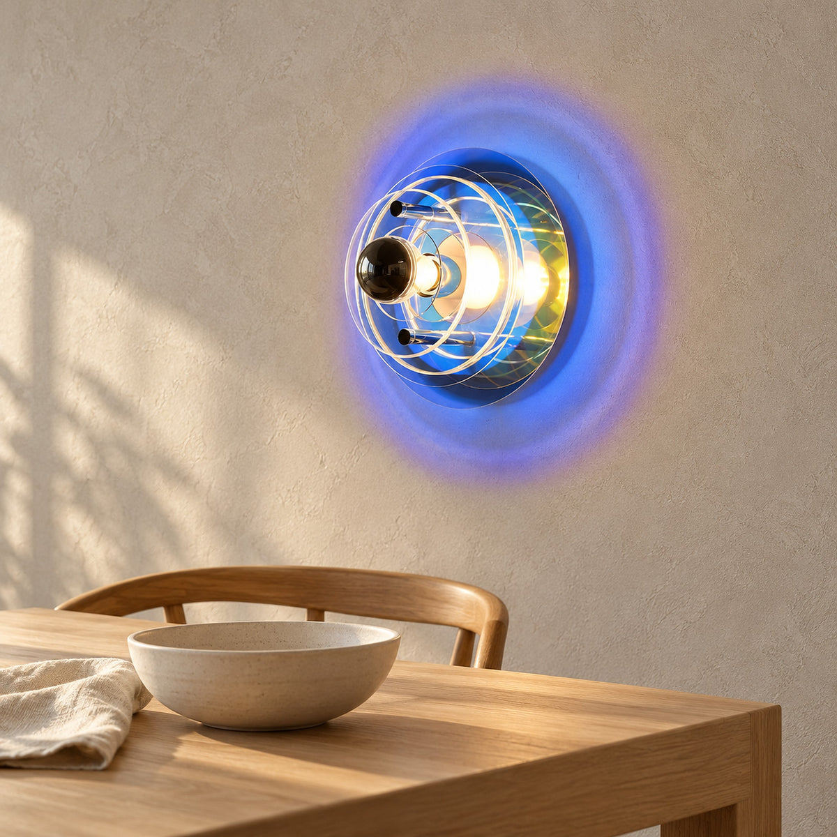 Elsarvo dark blue wall lamp glowing beside a dining table in daylight #color_dark blue