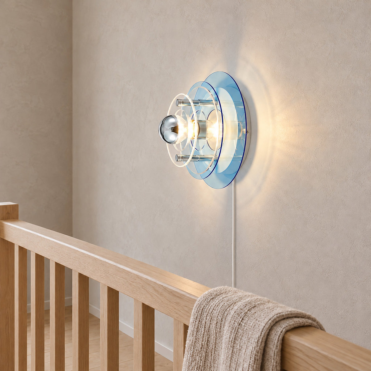 Elsarvo light blue plug in wall lamp on a landing showing its illuminated projecting layers #color_light blue