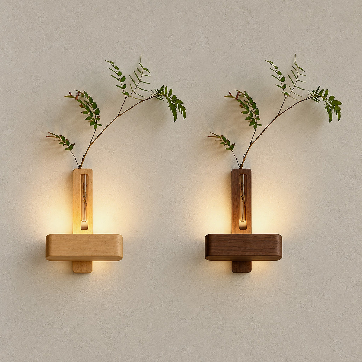 Ilaveno natural and walnut wall lights shown lit side by side in both wood finishes
