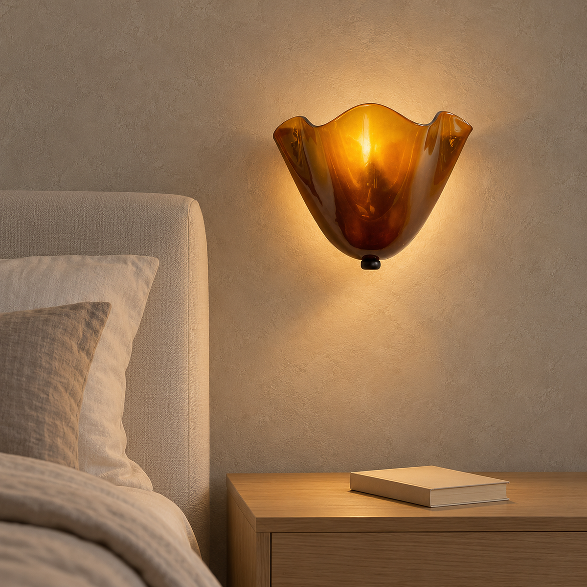Ilsaren amber plug in wall light glowing beside a bedside table in a bedroom #color_amber