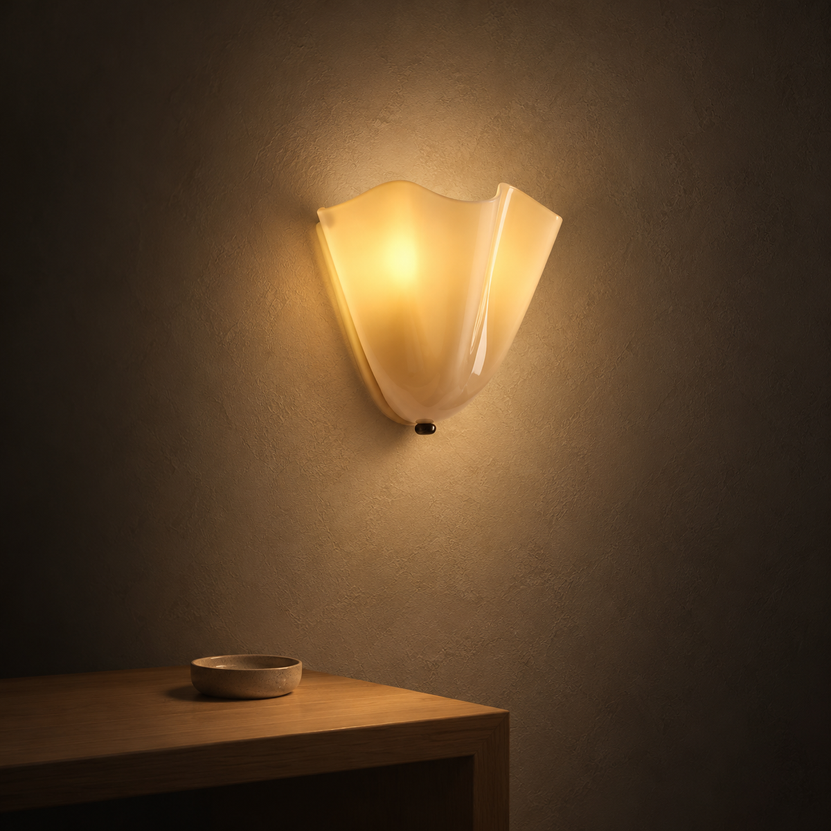 Ilsaren beige wall light glowing on a landing wall at night through its folded glass #color_beige