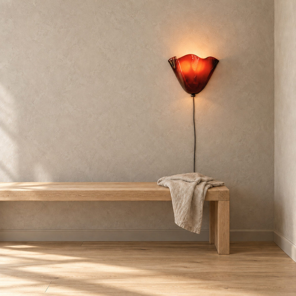 Lanorvi red glass wall lamp adding color above a bench on a sunlit stair landing #color_red