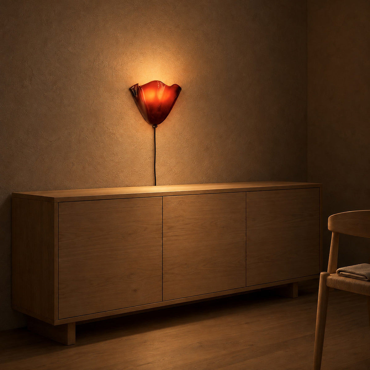 Lanorvi red glass wall light glowing in a dining room in the evening #color_red