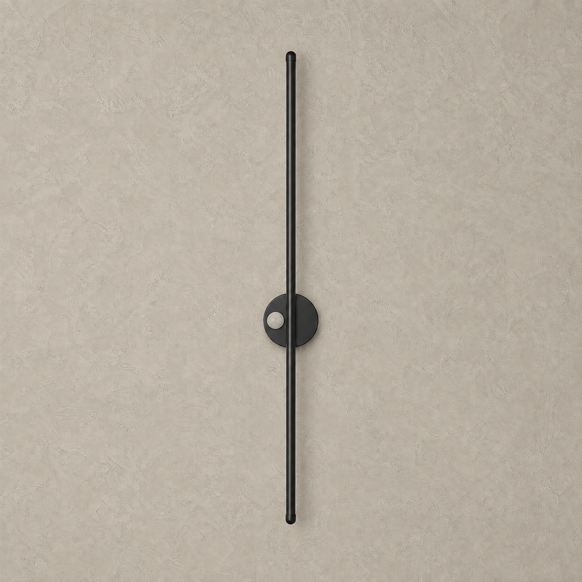 Lariveno black rechargeable wall sconce unlit on a greige plaster wall backdrop
