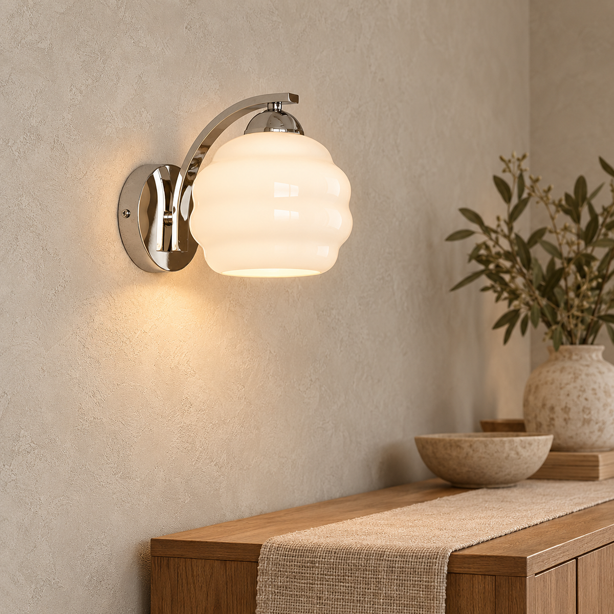 Lasemiro silver wall sconce canopy and curved arm mounted on a dining room wall