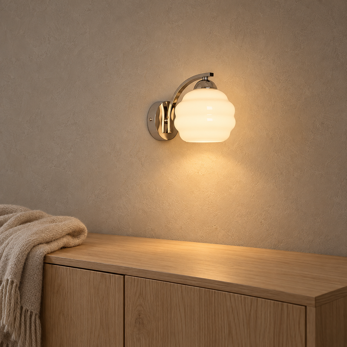 Lasemiro white frosted glass wall light lit above a living room sideboard in daylight