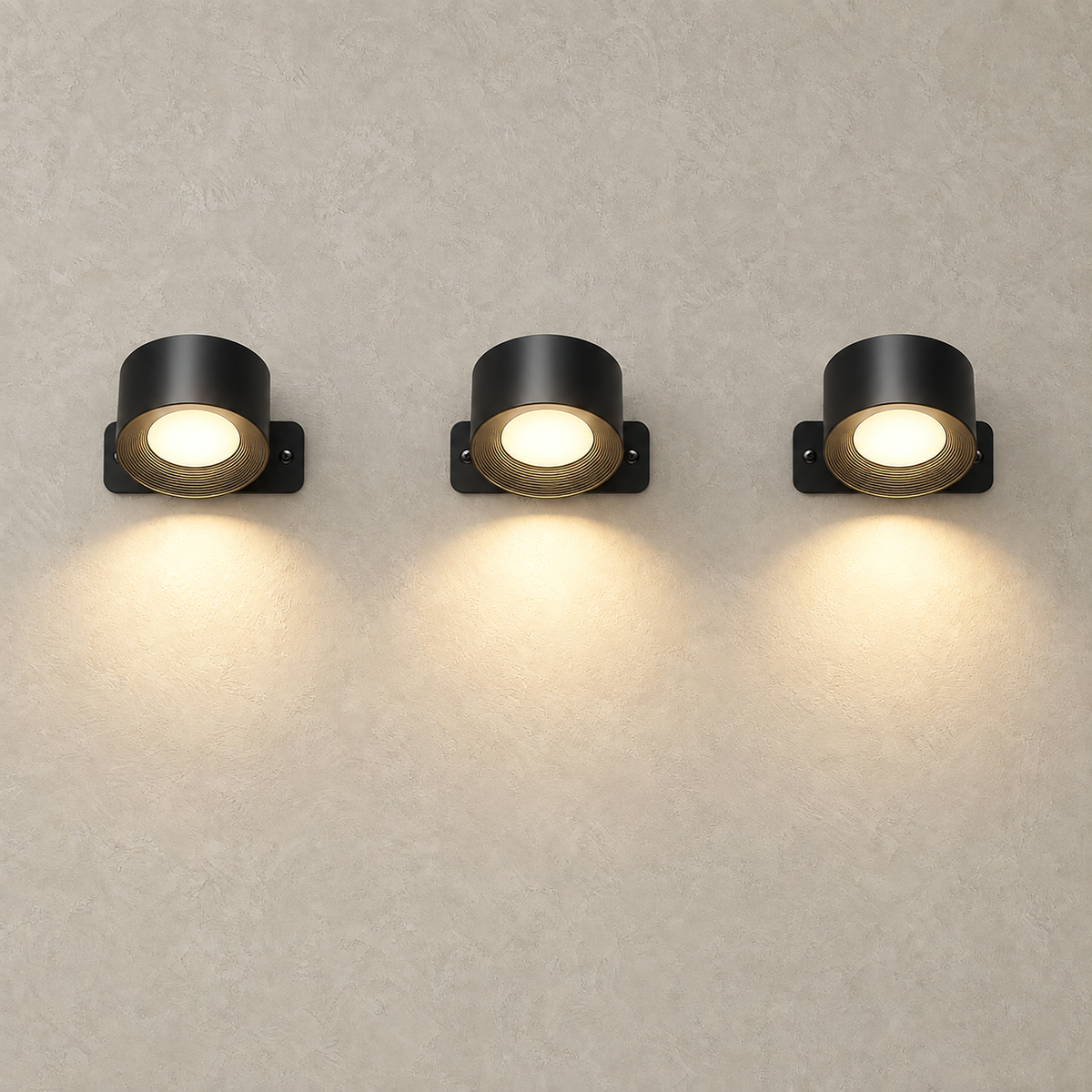 Lasirel black battery operated wall sconce set of 3 lit and standing in a row