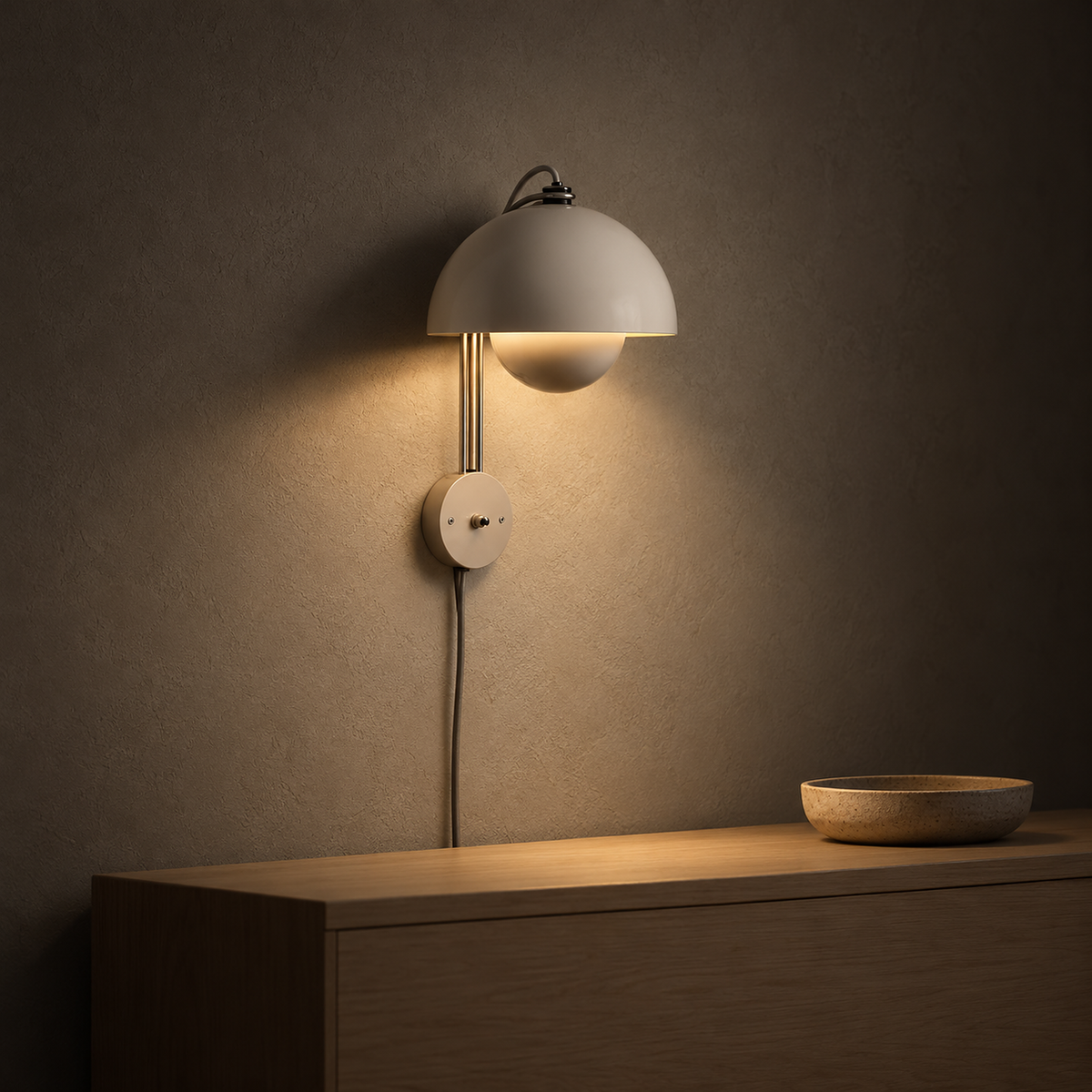 Lasorme cream plug in wall light at night, the bulb hidden under the dome with warm light spilling down