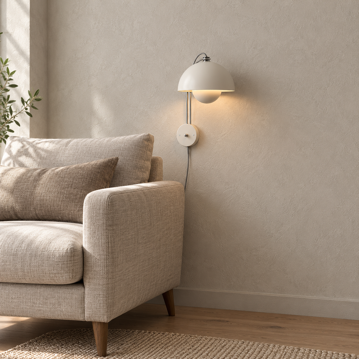 Lasorme cream plug in wall sconce detail of the round wall plate and the cord running down the wall