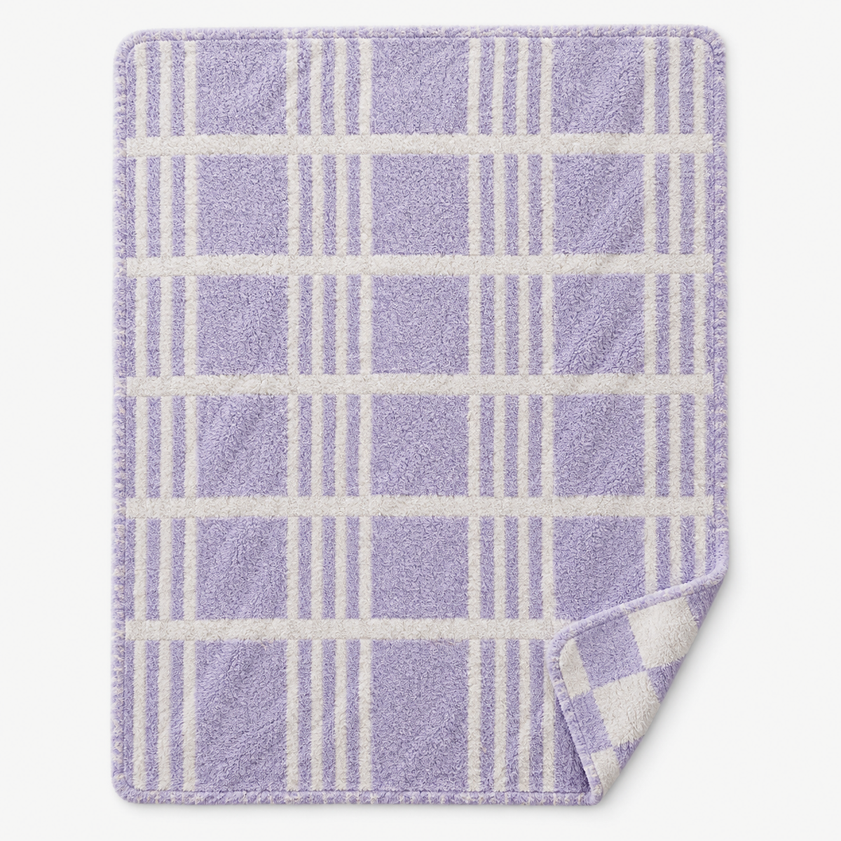 Lavimera reversible knit throw blanket opened flat to show its fluffy two color feather yarn knit