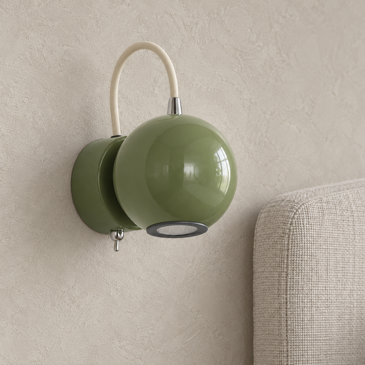 Lirema green wall sconce closeup of the glossy painted head and its circular opening