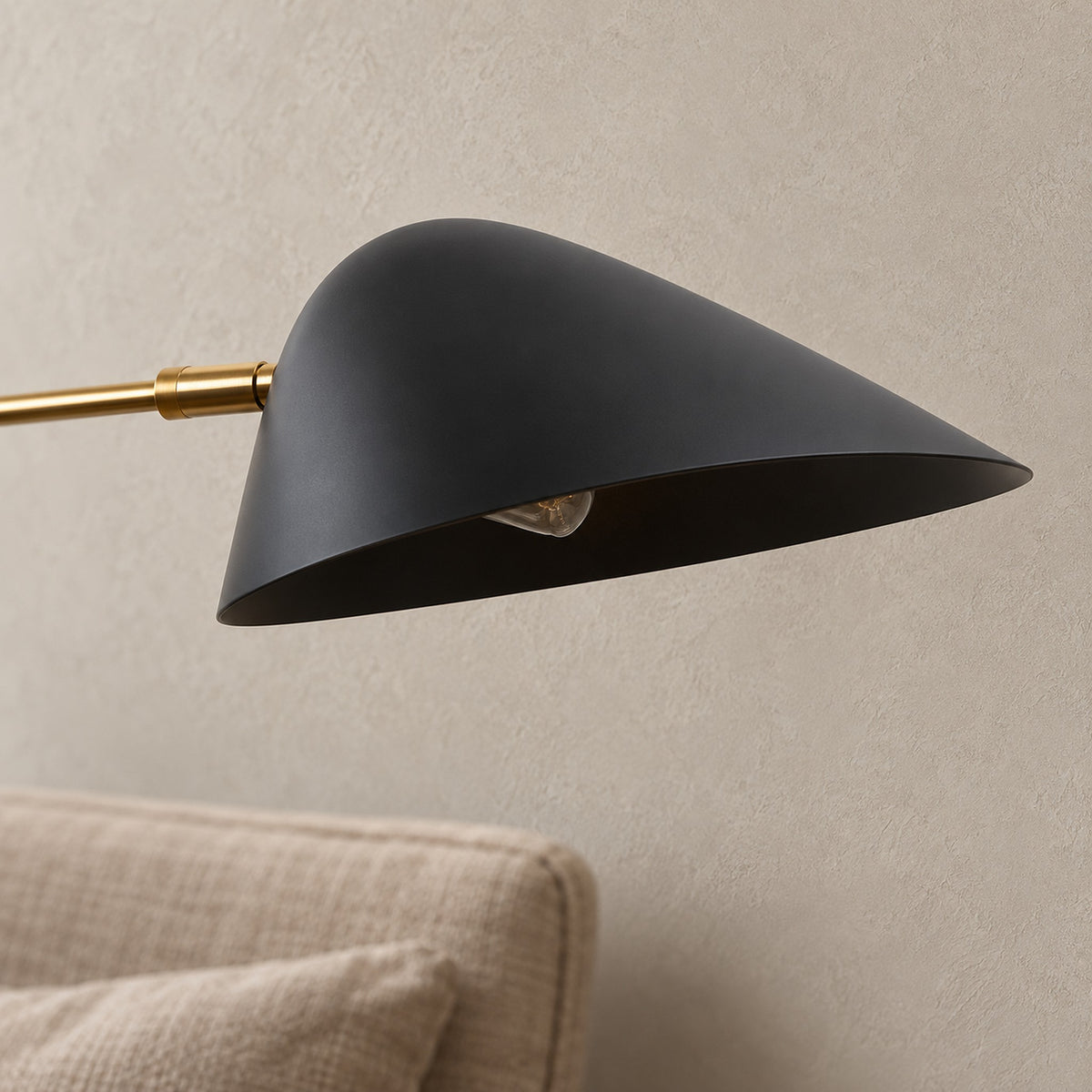 Lirmena black led wall sconce, close view of the shade and plated finish in daylight