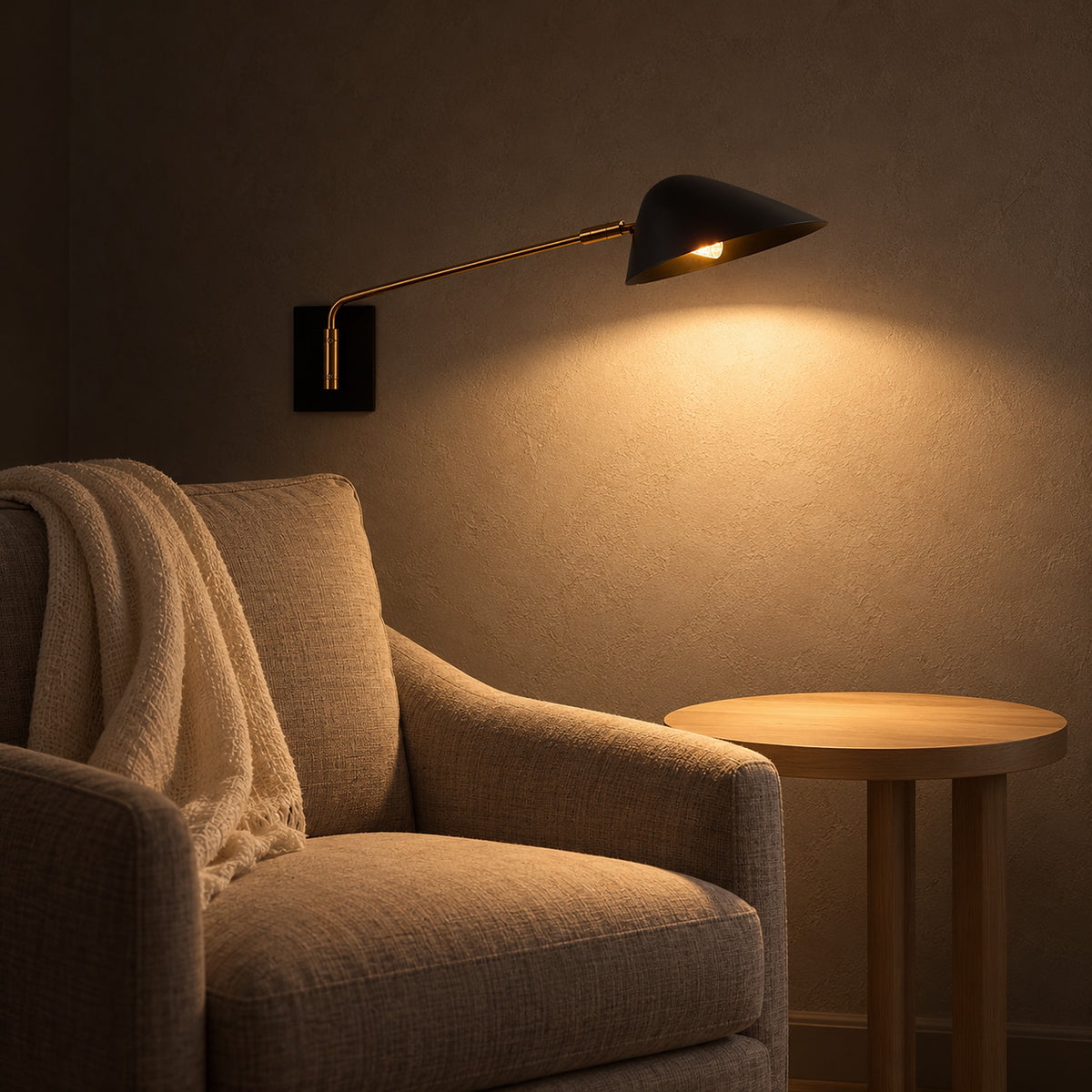 Lirmena black wall sconce lighting a calm armchair corner in the living room at night