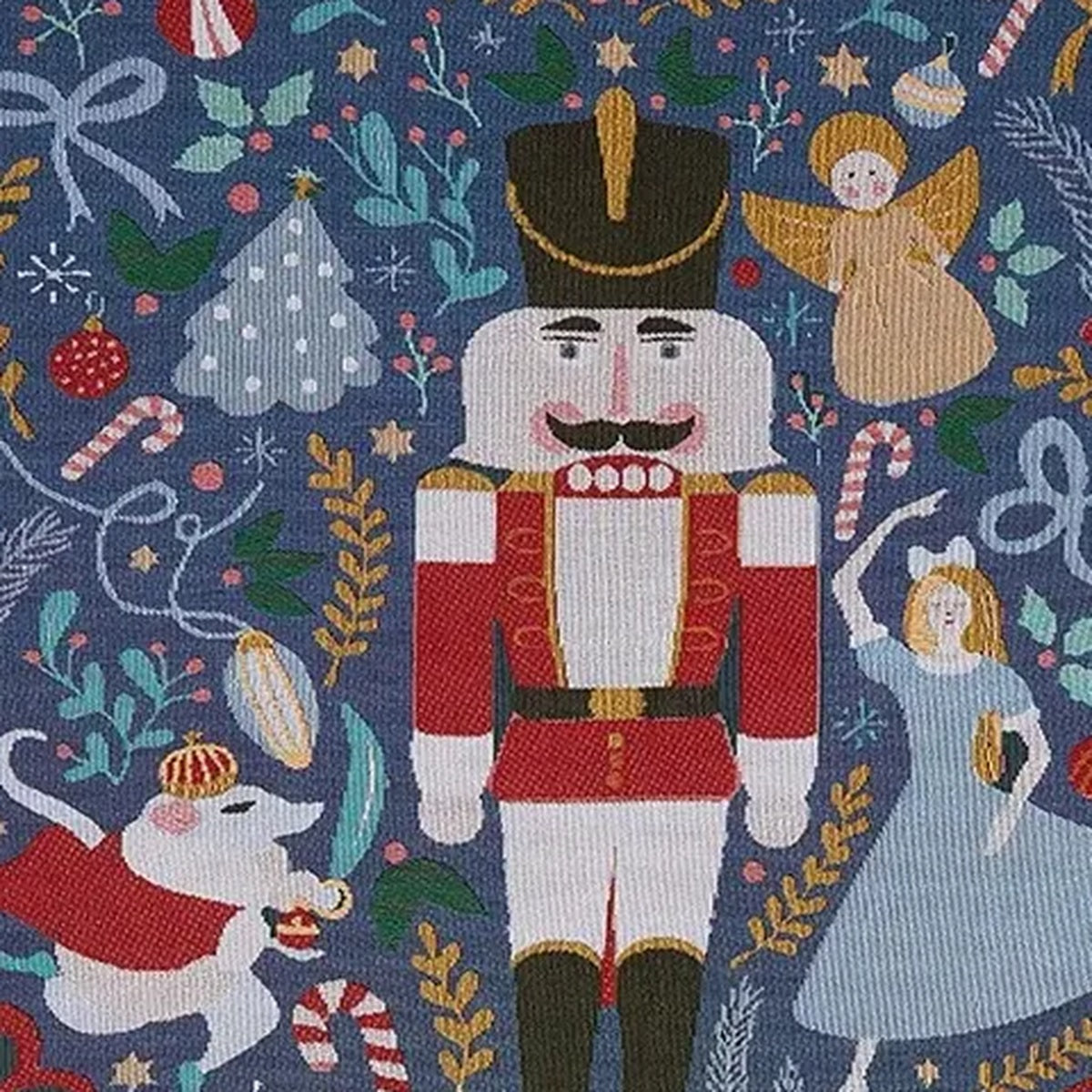 Close up of Lisorvan christmas cotton throw blanket showing a nutcracker, angel and mouse on blue fabric.