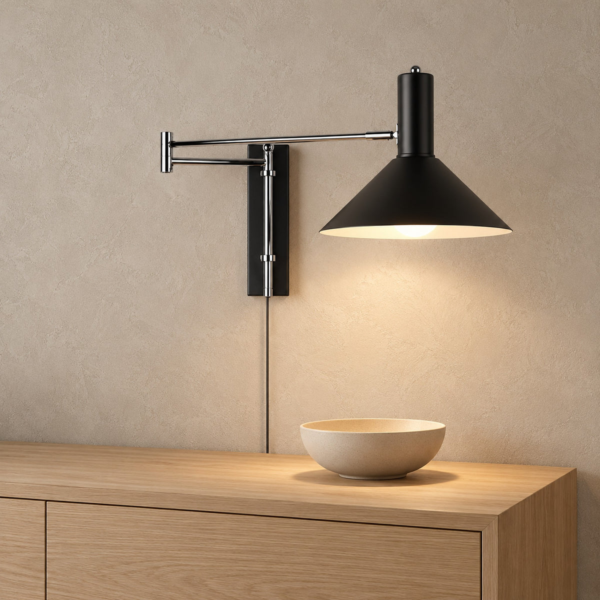 Lomaresi black wall sconce, close view of the wall mounting plate and arm in an entry hall