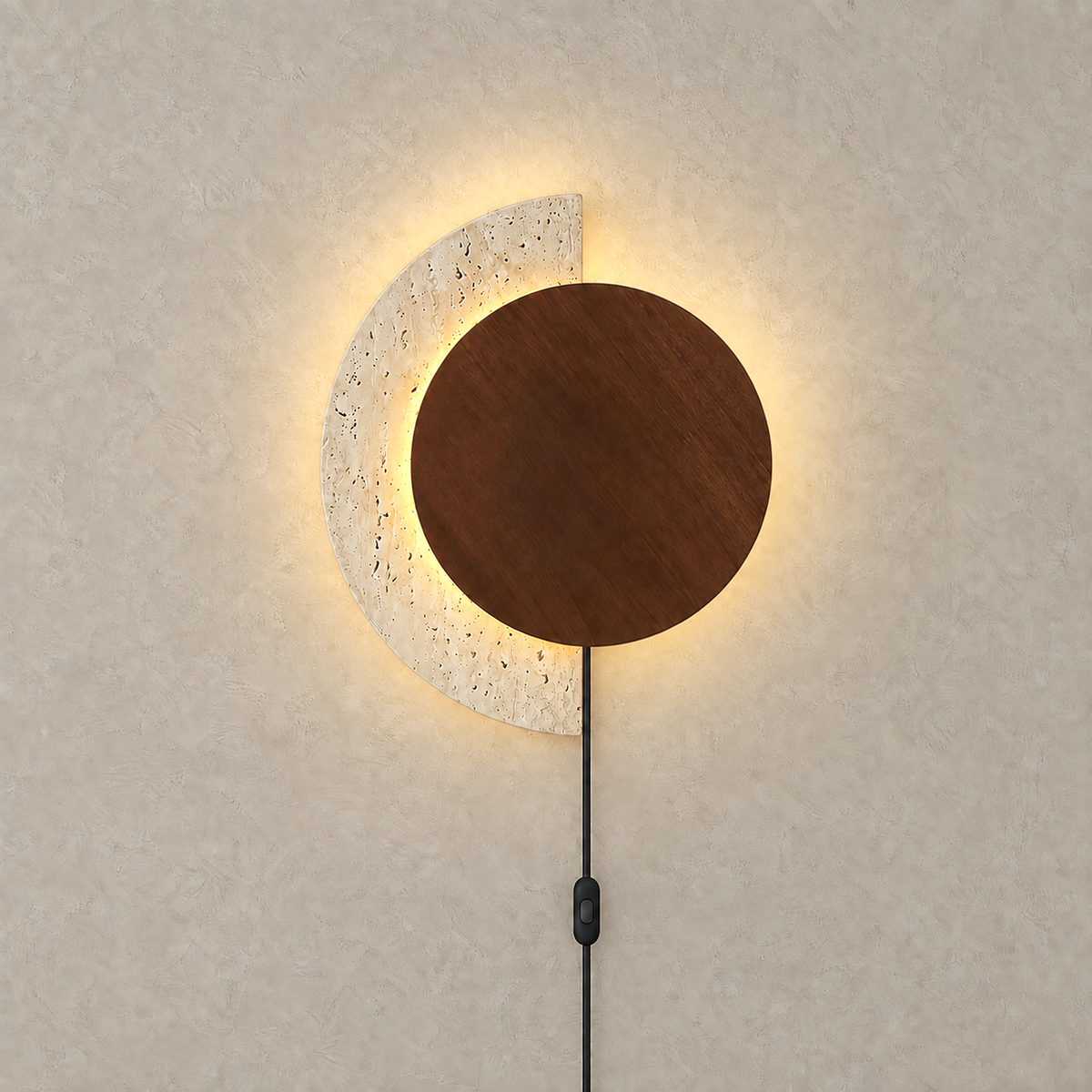 Lomavo walnut LED wall sconce lit with warm concealed backlight behind the wood disc