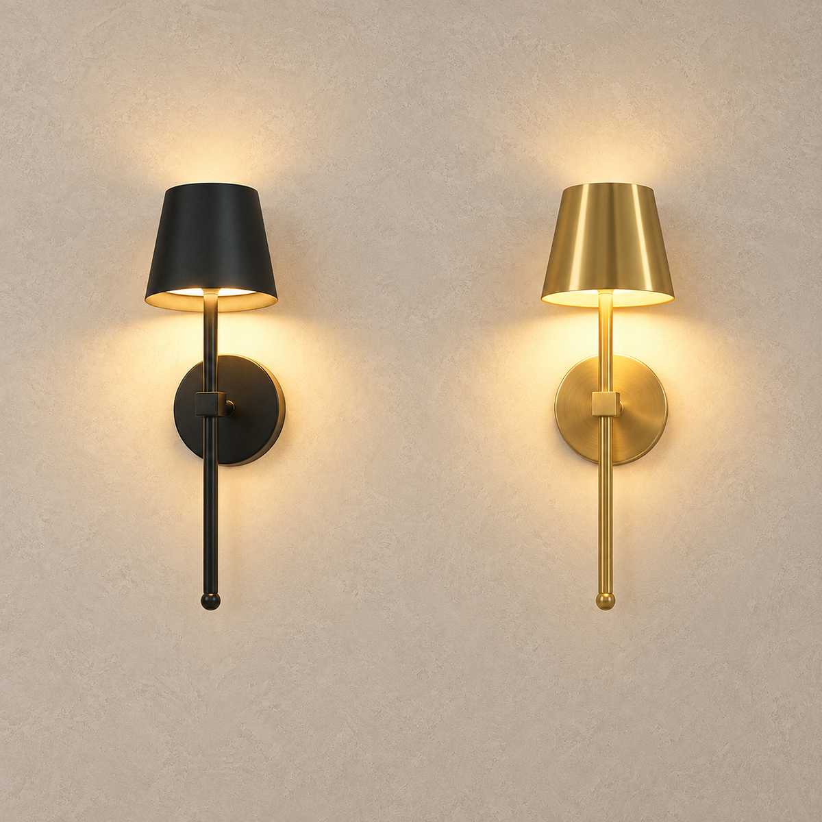 Loranno LED wall sconce in black and gold finishes lit side by side on a plaster wall
