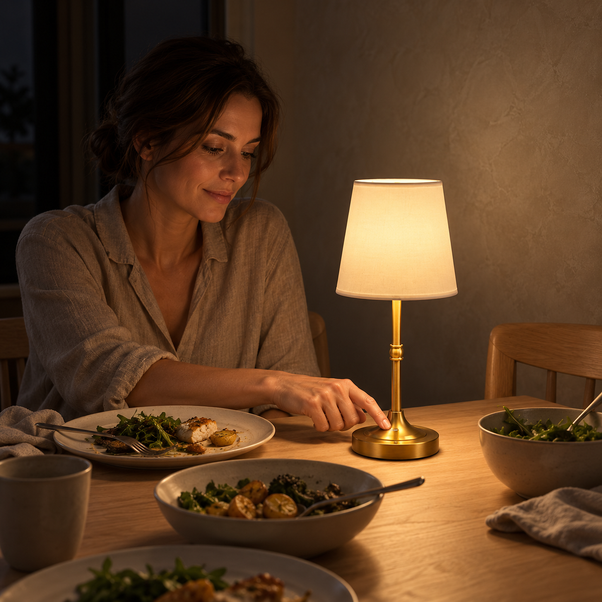 Lorvesa gold portable table lamp lighting a quiet dinner at home in the kitchen at night