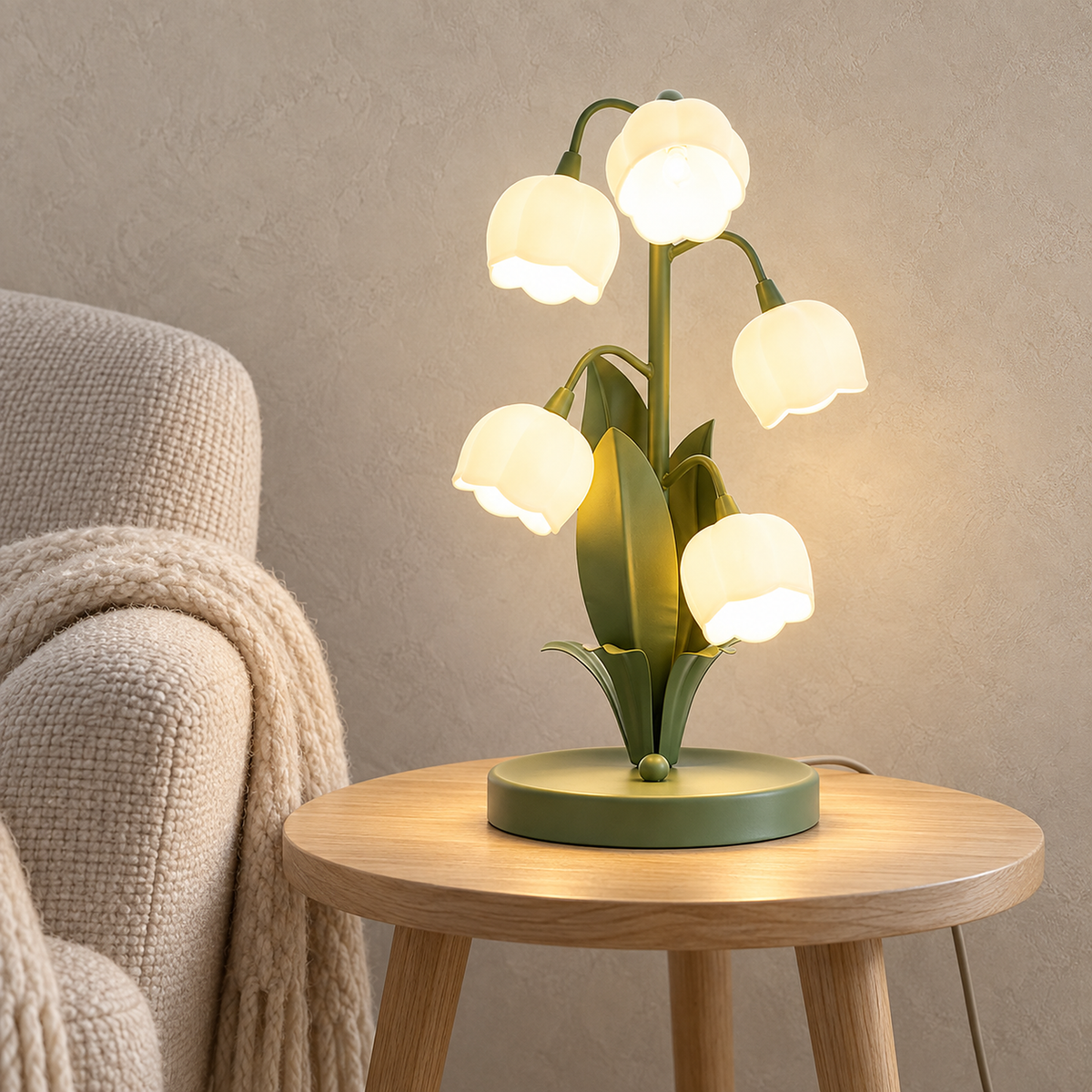 Marosine floral table lamp with green body and white flower shades glowing on a study side table