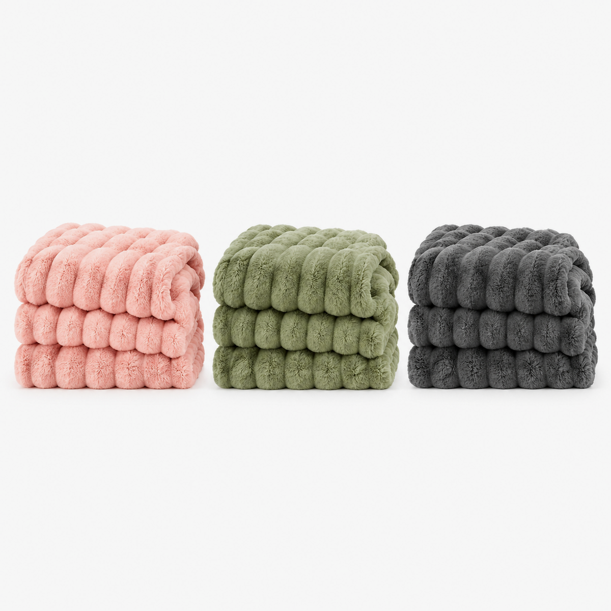 Mavilore coral fleece blankets in pink, matcha green and dark gray, folded together on white