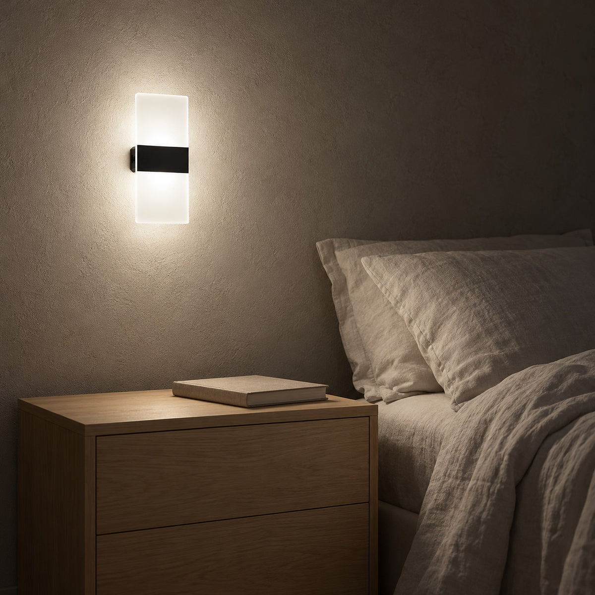 Melavor black rechargeable wall sconce switched on by touch beside the bed at night