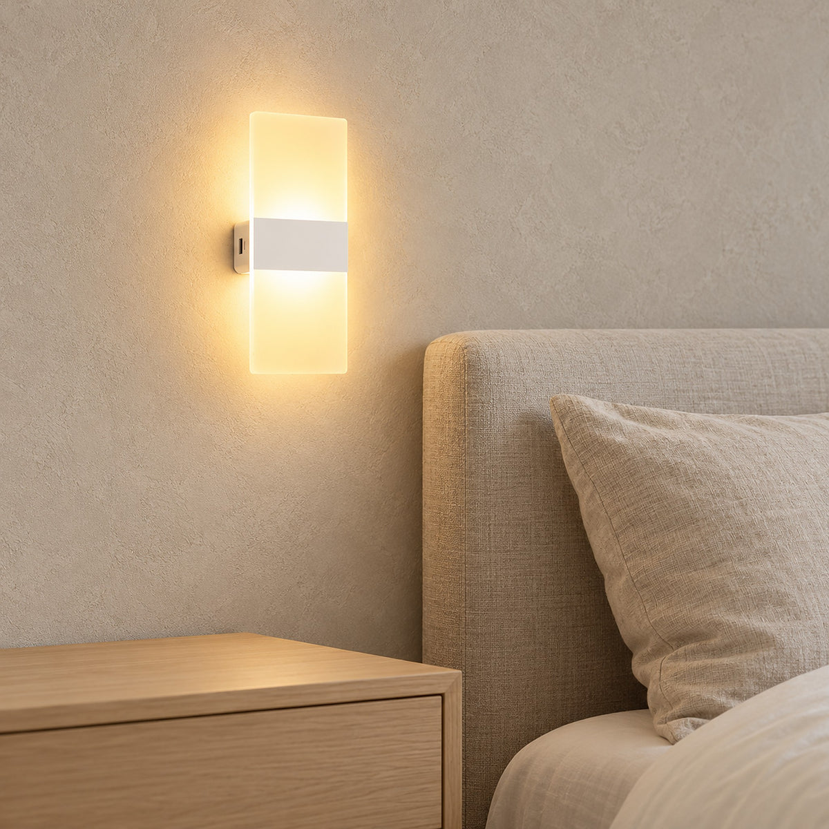 Melavor white bedside wall light glowing beside an oatmeal headboard in a sunlit bedroom #color_white