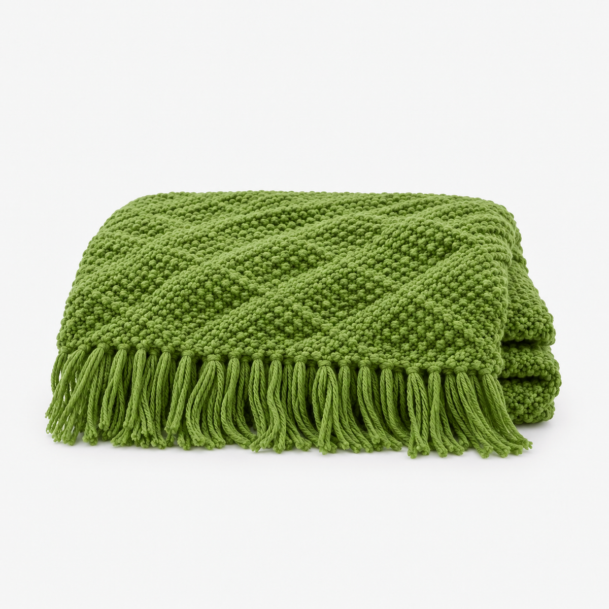 Melsavo grass green knit throw blanket loosely folded with fringed ends
