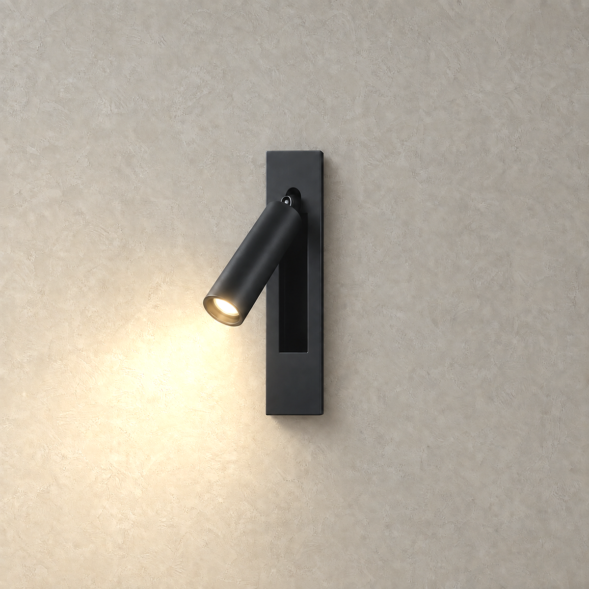 Menaliro black LED wall sconce switched on against greige plaster, warm white glow from its head