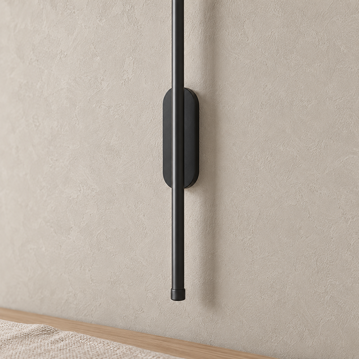 Menalvo black wall lamp, matte rod and rounded backplate detail in natural daylight
