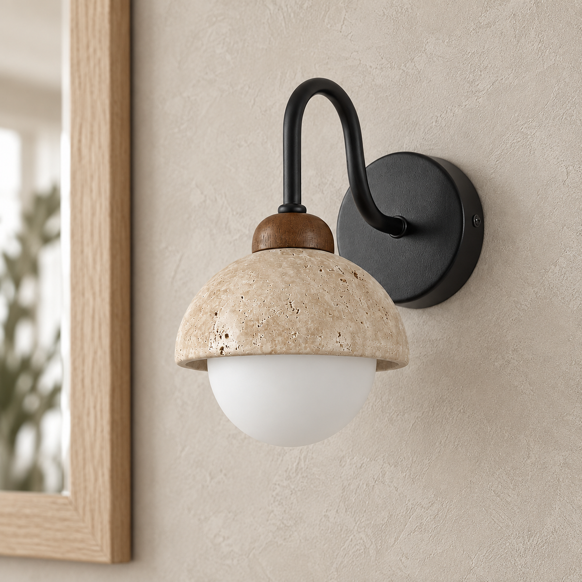 Meratilo yellow travertine and black hardwired wall sconce unlit close up on the stone dome and walnut collar