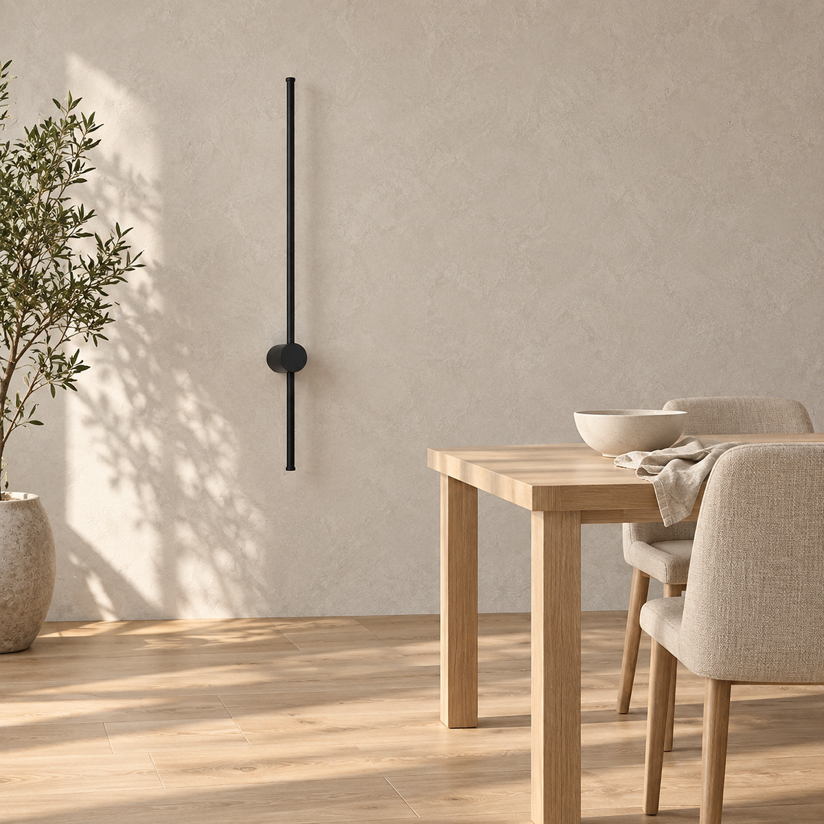 Merisano black rechargeable wall sconce switched off beside dining room furniture in sunlight