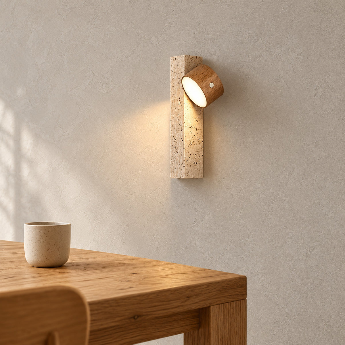 Mernavo light wood and yellow travertine cordless wall lamp lit above a dining table corner #color_light wood & yellow travertine