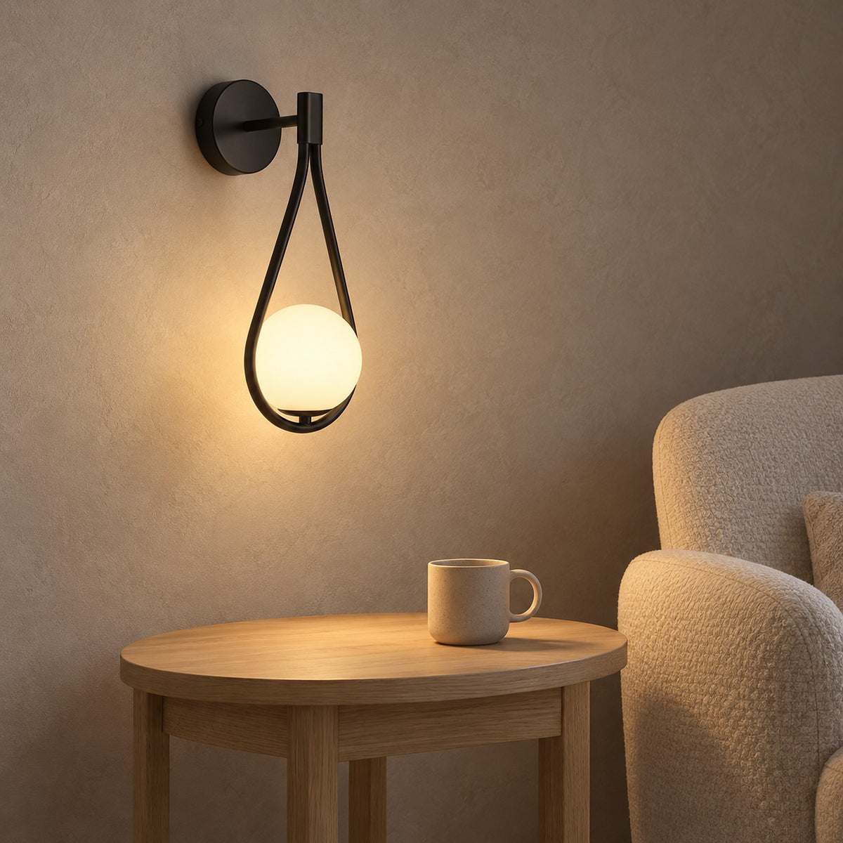 Mesaril black wall light in a reading corner, wall mounted to leave table space for a cup #color_black