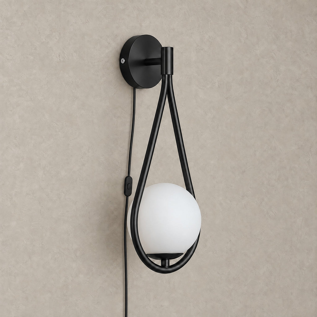 Mesaril black plug in wall sconce with its power cord and on/off switch running down the wall #color_black
