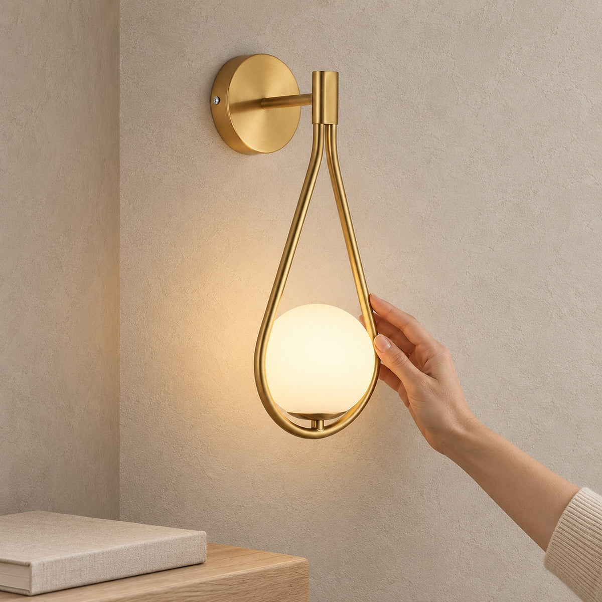 Mesaril gold wall lamp lit on the wall of a compact stair landing