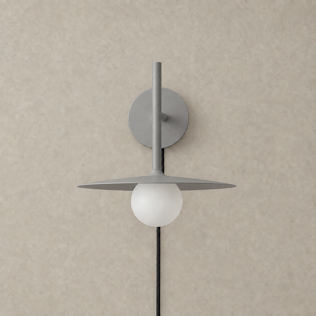 Milvaro gray wall sconce unlit showing its metal disc and frosted glass shade #color_gray