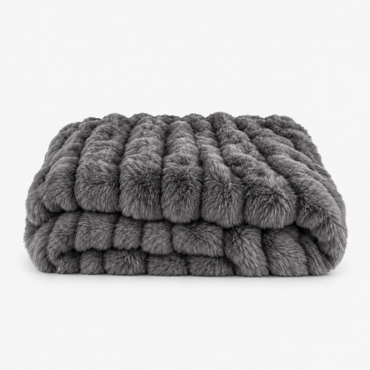 Molvari black faux fur throw blanket loosely folded on a plain studio backdrop #color_black