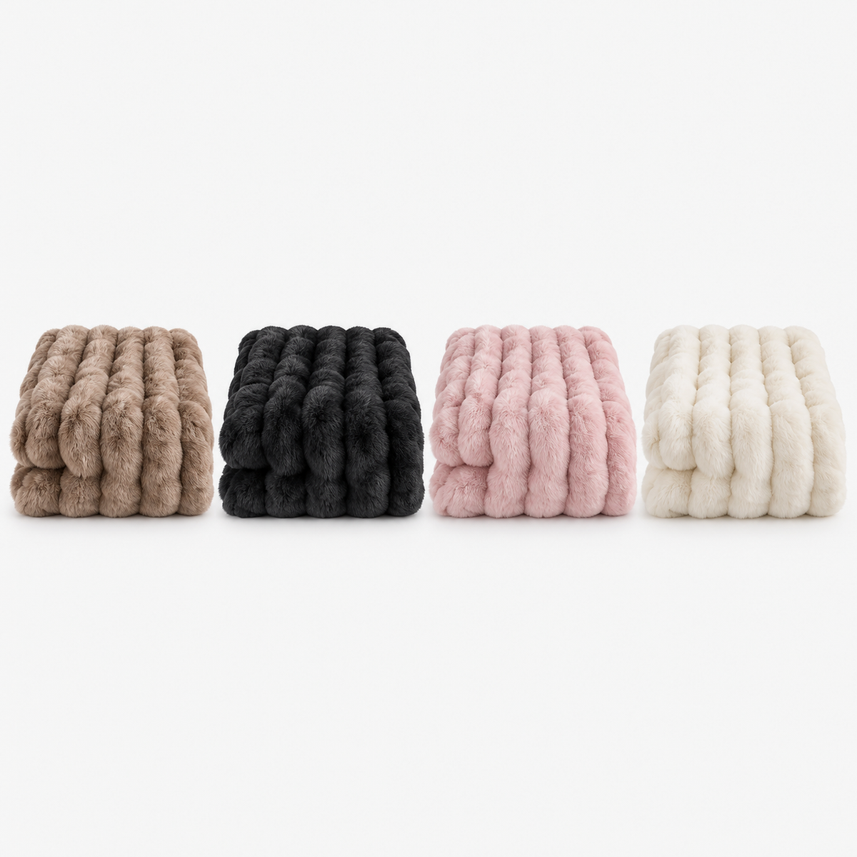 Molvari faux fur throw blanket in brown, black, pink and white folded side by side for comparison